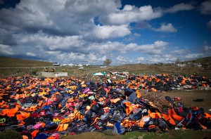 MITHYMNA, GREECE - MARCH 10: Hundreds of used life vests lie on a makeshift rubbish dump hidden in the hills above the town on March 10, 2016 in Mithymna, Greece. Local authorities start to clean the beaches from life vests and destroyed dinghies, used by refugees and migrants after crossing the sea from Turkey to Lesbos. The village of Mithymna is the northest town of the Island of Lesbos and located 75 kilometres north of the Capitol Mytilini. Migrants and refugees are still arriving on the shores of the Island of Lesbos, while Joined Forces of the Standing NATO (North Atlantic Treaty Organisation) Maritime Group 2 are patrolling the coast of the greek Island of Lesbos and the turkish coast. Turkey has announced on Monday to take back illegal migrants from Syria and to exchange those with legal migrants. (Photo by Alexander Koerner/Getty Images)