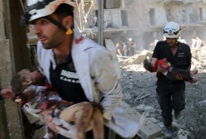 Men carry the bodies of children following a reported bombardment with explosive-packed "barrel bombs" by Syrian government forces in the al-Mowasalat neighborhood of the northern Syrian city of Aleppo on April 27, 2014. Aleppo is divided between government and opposition control, and clashes on the ground, rebel fire and regime aerial bombardment have all increased there in recent weeks. AFP PHOTO / ALEPPO MEDIA CENTRE / ZEIN AL RIFAI === GRAPHIC CONTENT== (Photo credit should read ZEIN AL-RIFAI/AFP/Getty Images)